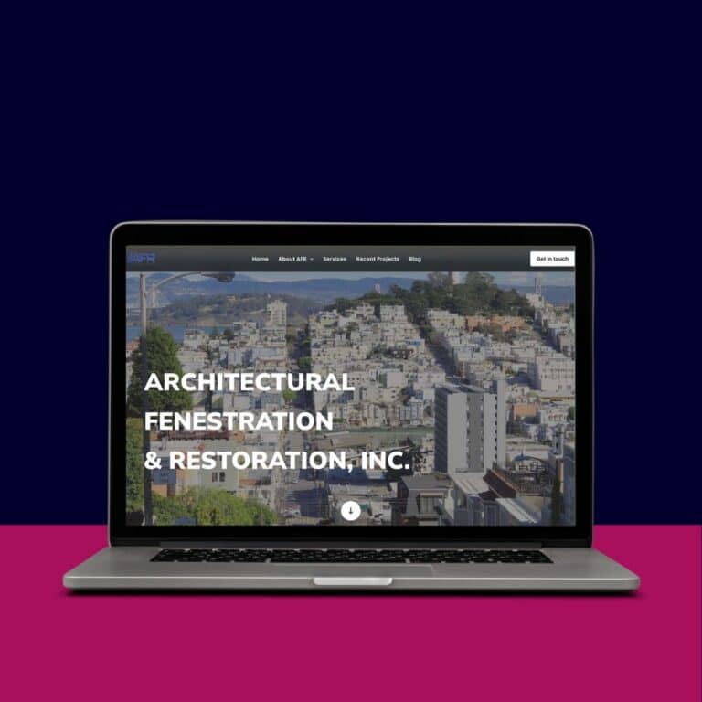 Laptop displaying architectural fenestration and restoration website.